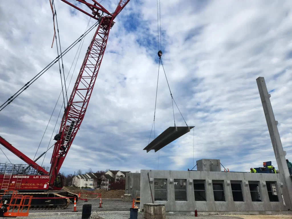 Precast Services using a crane to place precast slab components.