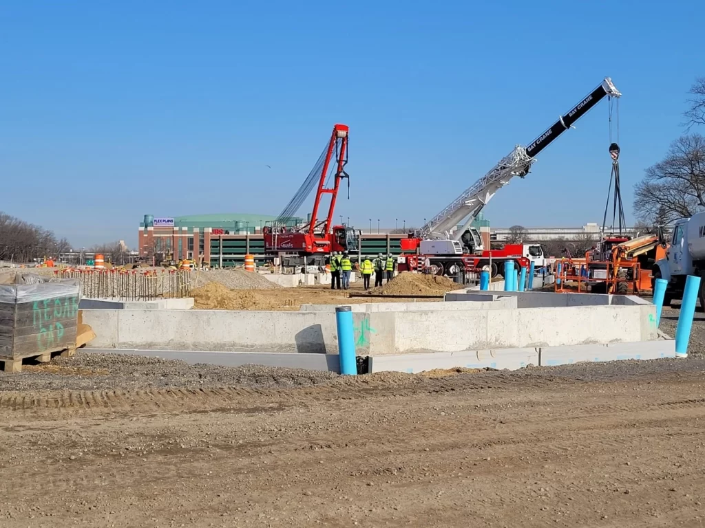 Precast Services using cranes to erect precast panels.