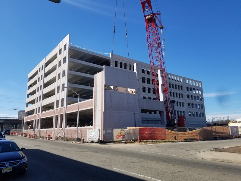 Crossing at Brick Church Station Parking Garage. Under construction with crane.