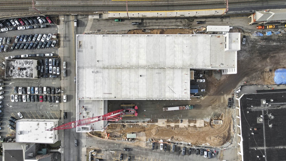 Crossing at Brick Church Station Parking Garage. Aerial view of roof. Under construction with crane.